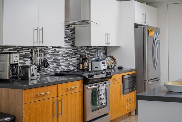 kitchen featuring white cabinets, stainless steel appliances, exhaust hood, and tasteful backsplash