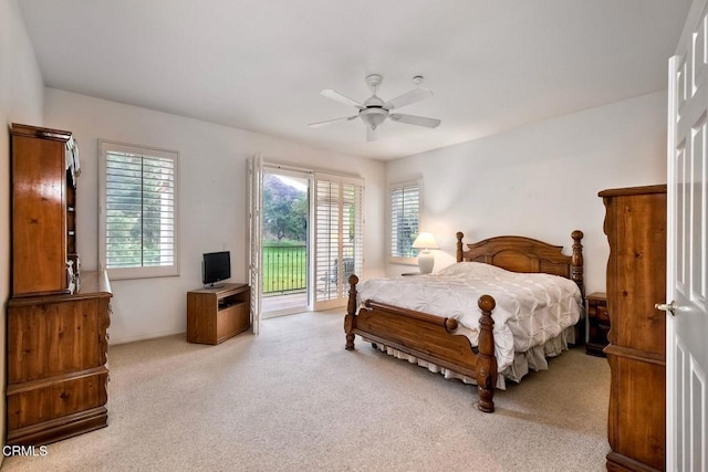 carpeted bedroom featuring ceiling fan and access to exterior