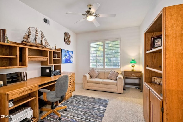 office area featuring ceiling fan and light carpet