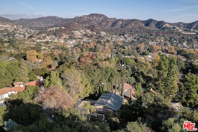 birds eye view of property featuring a mountain view