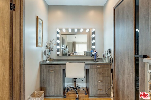 bathroom with wood-type flooring and vanity