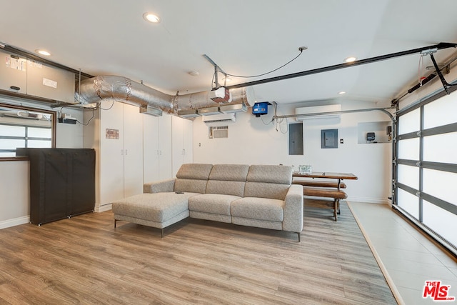 living room with hardwood / wood-style flooring and electric panel