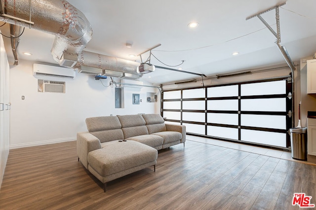 garage featuring a garage door opener, electric panel, and an AC wall unit