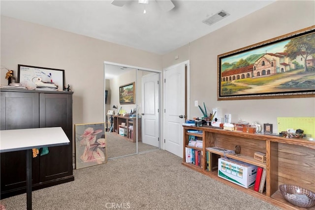 interior space featuring ceiling fan and a closet