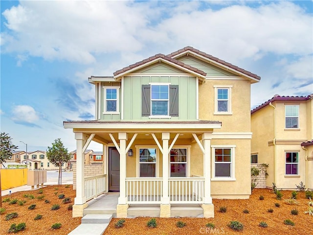 view of front of property featuring covered porch