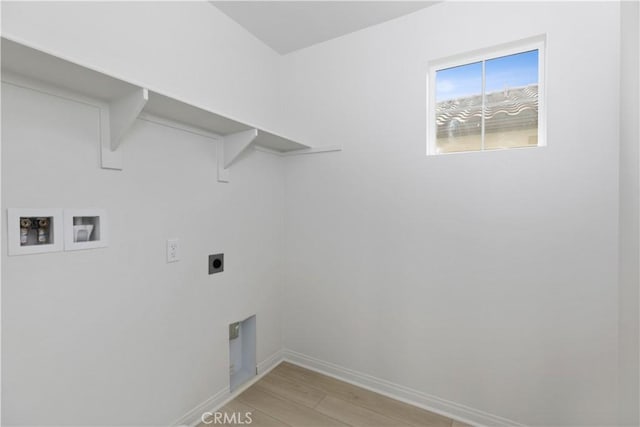 clothes washing area featuring washer hookup, electric dryer hookup, and light hardwood / wood-style floors