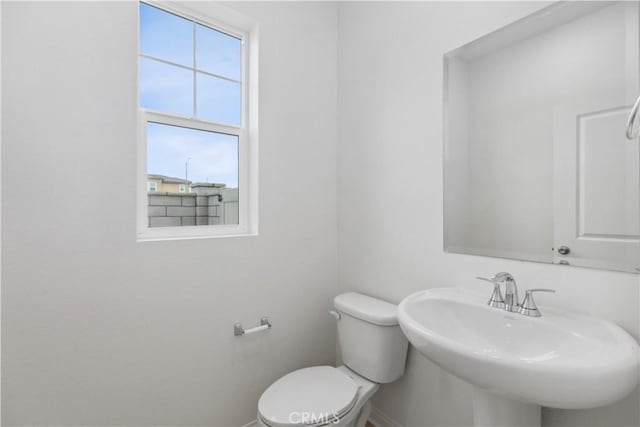 bathroom with sink and toilet