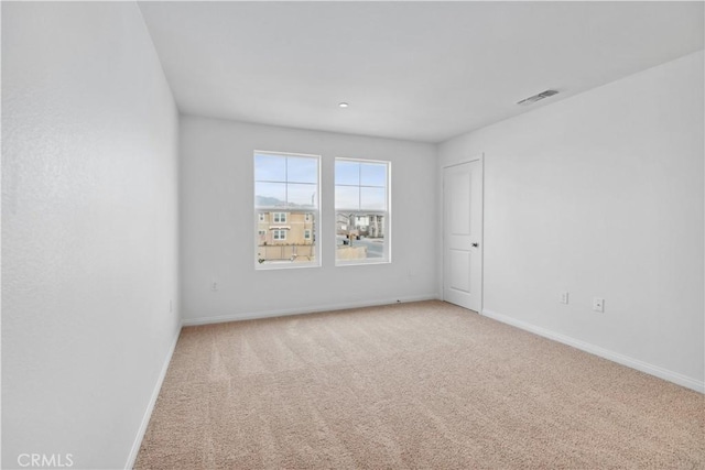 view of carpeted spare room