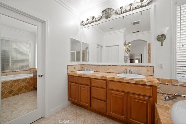 full bath with crown molding, tile patterned flooring, a garden tub, and a sink