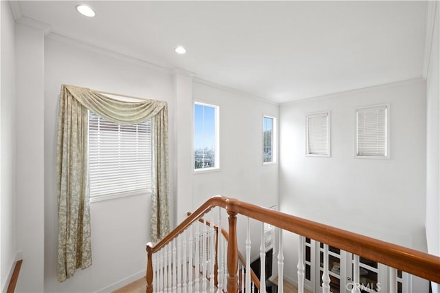 corridor with ornamental molding, recessed lighting, baseboards, and an upstairs landing