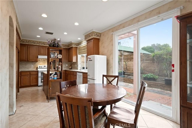 dining room featuring ornamental molding, recessed lighting, visible vents, and light tile patterned flooring