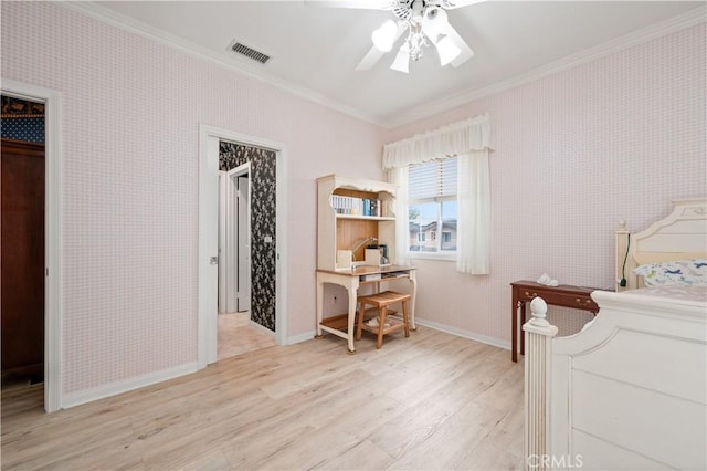 bedroom featuring wallpapered walls, light wood-style floors, visible vents, and crown molding