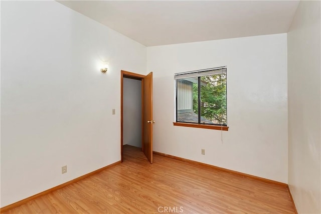 spare room with light wood-type flooring