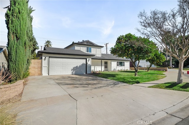 view of front facade featuring a front lawn and a garage