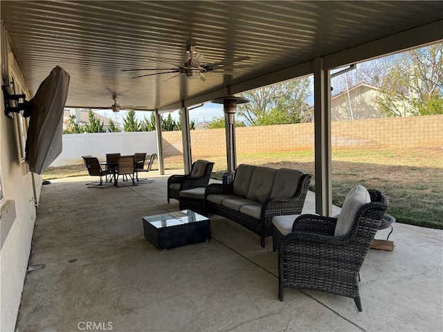 view of patio with ceiling fan and an outdoor living space