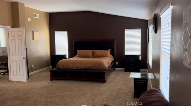 bedroom with lofted ceiling and light carpet