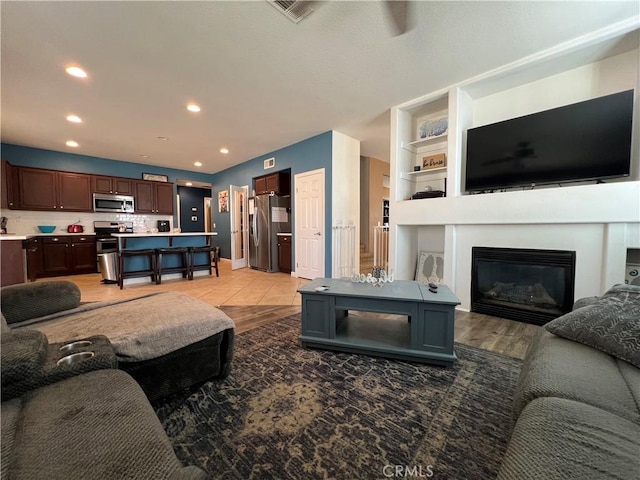 living room with light hardwood / wood-style floors