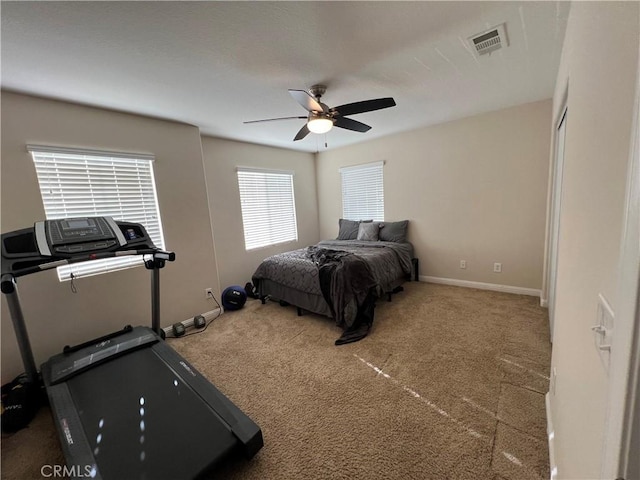 bedroom featuring ceiling fan and carpet