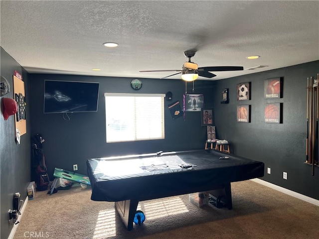 rec room with a textured ceiling, ceiling fan, carpet flooring, and pool table