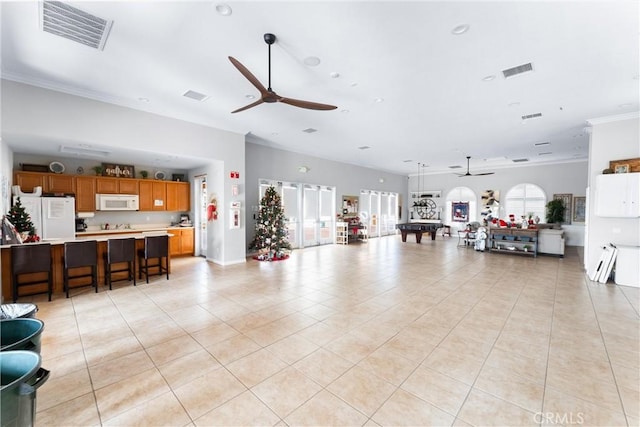 living room with ceiling fan, light tile patterned floors, crown molding, and billiards