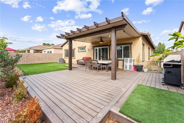 wooden terrace with ceiling fan, central AC unit, a grill, and a yard