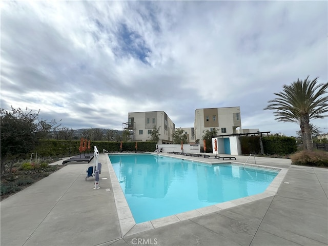 view of swimming pool with a patio area