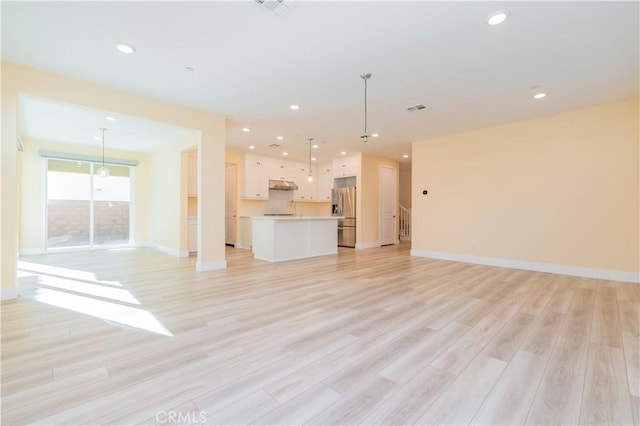 unfurnished living room with light wood-type flooring