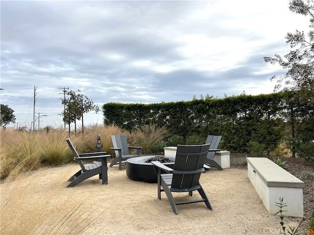 view of patio / terrace featuring an outdoor fire pit