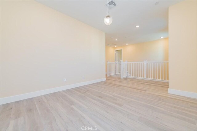 empty room with light wood-type flooring