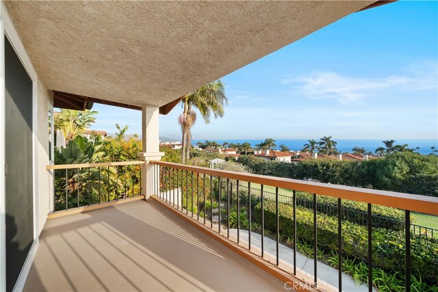 balcony featuring a water view