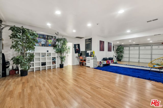 workout room featuring hardwood / wood-style flooring