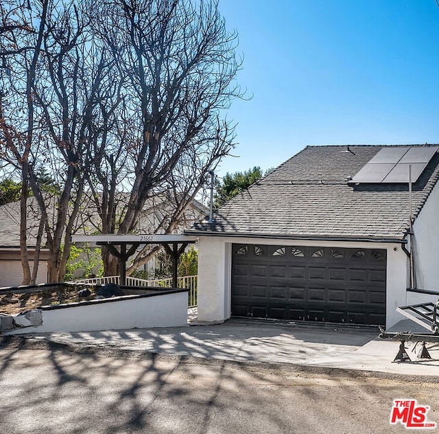 garage featuring solar panels