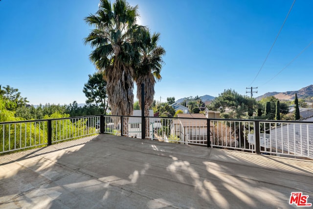 view of patio / terrace with a mountain view