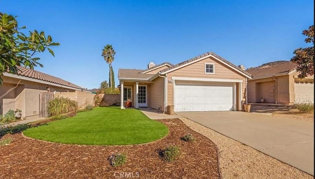 view of front facade with a front yard and a garage