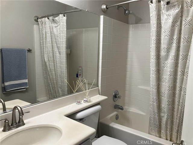 full bathroom with toilet, vanity, and shower / tub combo with curtain