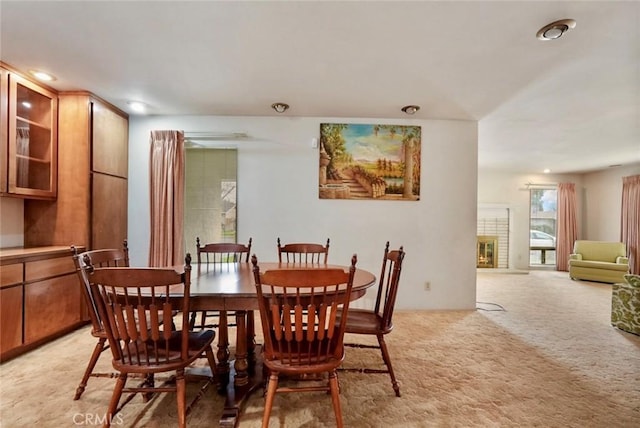 dining space with light carpet