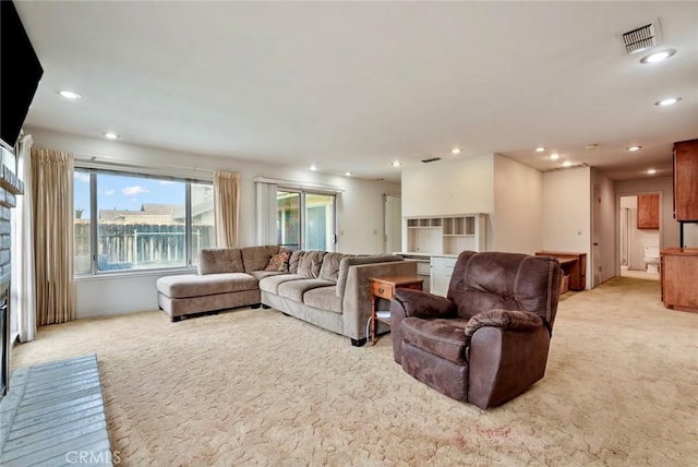 living room featuring light carpet