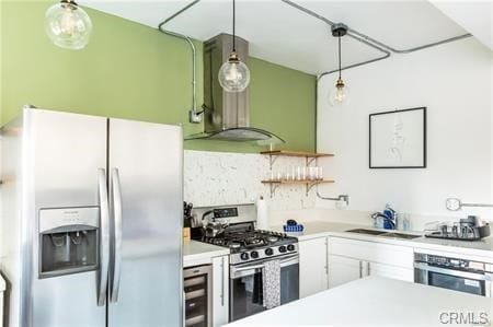 kitchen with wine cooler, sink, white cabinetry, hanging light fixtures, and appliances with stainless steel finishes