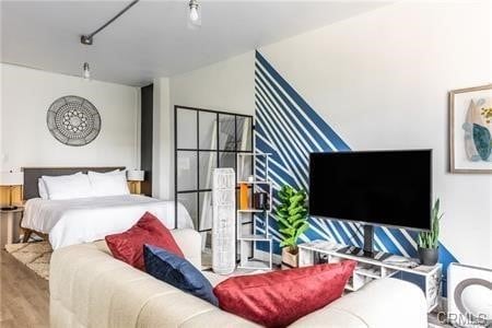 bedroom featuring hardwood / wood-style floors