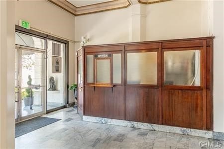 interior space with crown molding