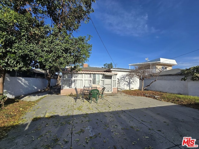 rear view of house with a patio