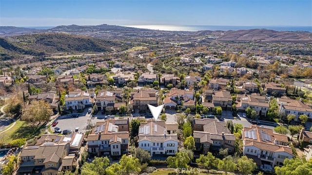 birds eye view of property with a mountain view