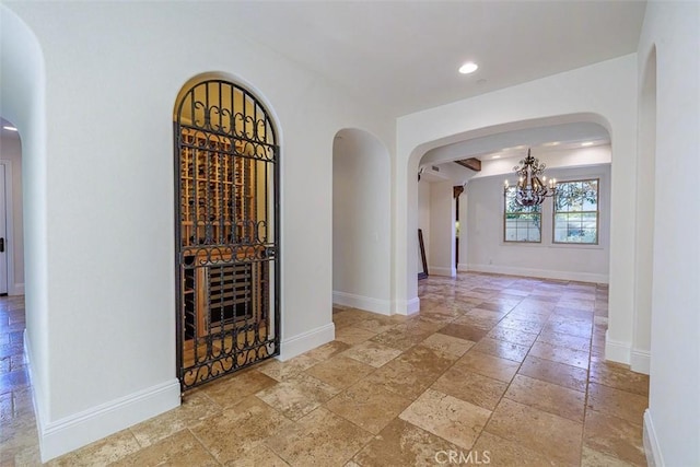 wine area with an inviting chandelier