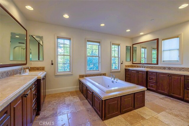 bathroom featuring vanity and a bathing tub