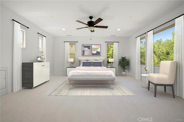 bedroom featuring light carpet and ceiling fan