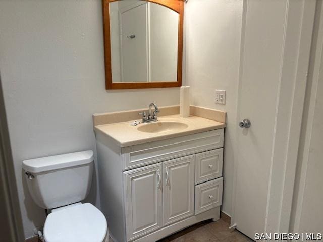 bathroom featuring toilet and vanity