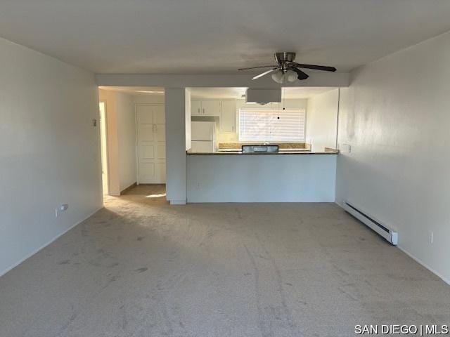 unfurnished living room featuring ceiling fan, baseboard heating, and light carpet