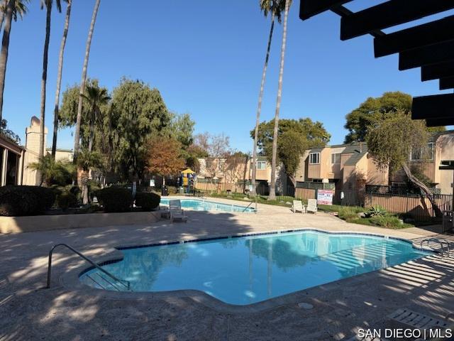 view of swimming pool with a patio area