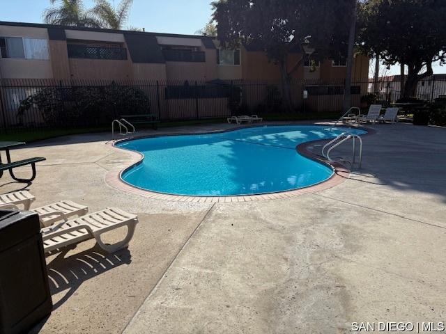 view of pool featuring a patio