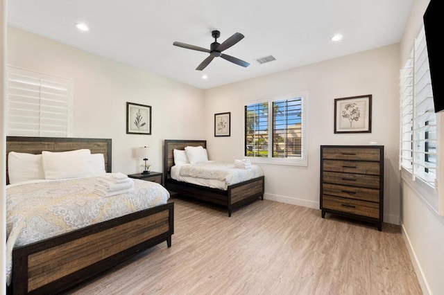 bedroom featuring ceiling fan and light hardwood / wood-style flooring